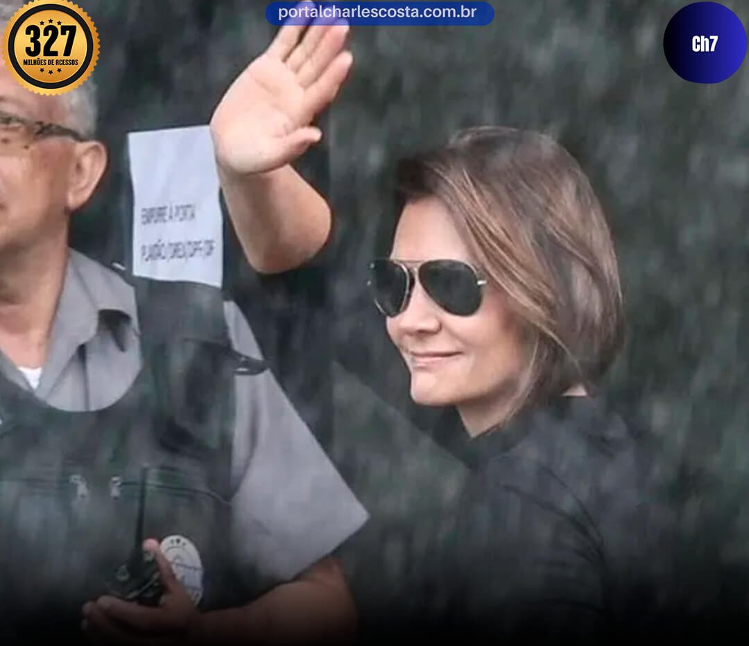 Michelle Bolsonarocom seus oculos escuro acena ao publico