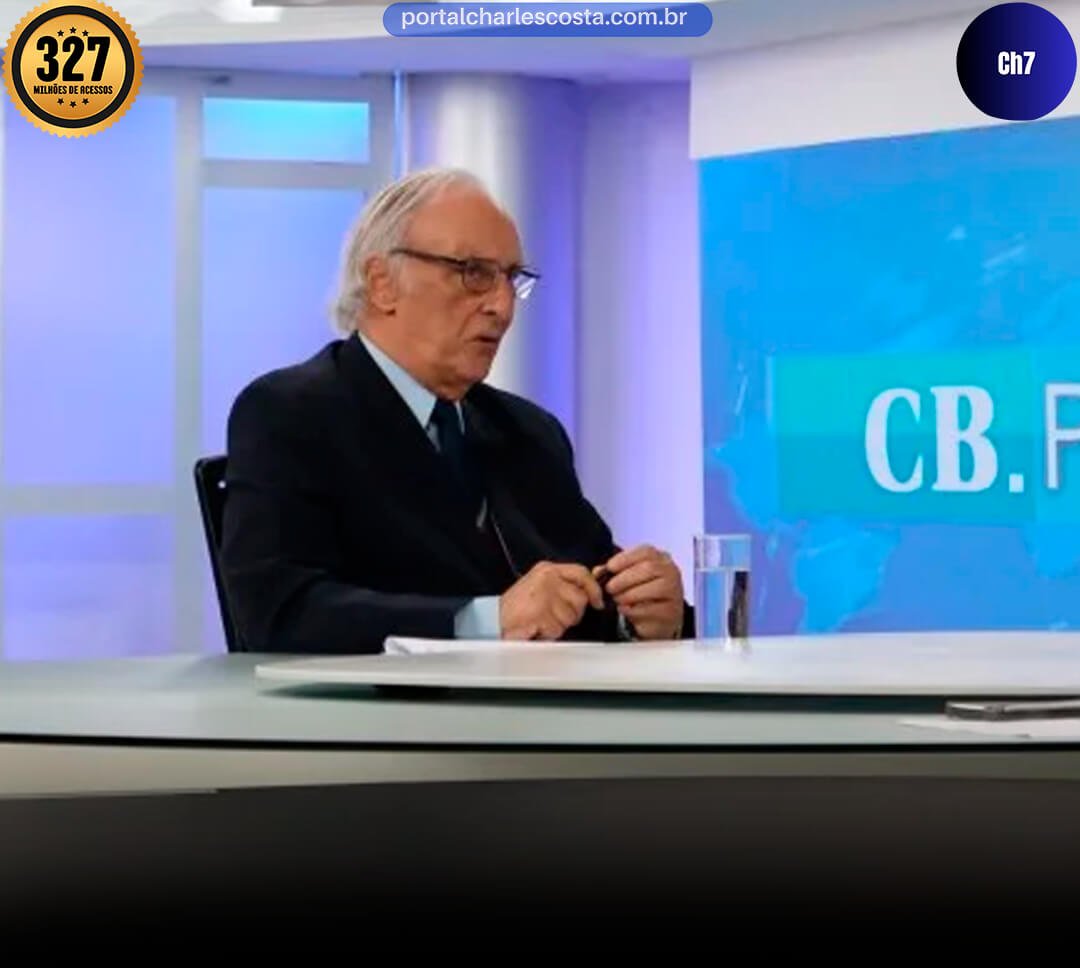 José Geraldo na bancada de jornal sendo entrevistado