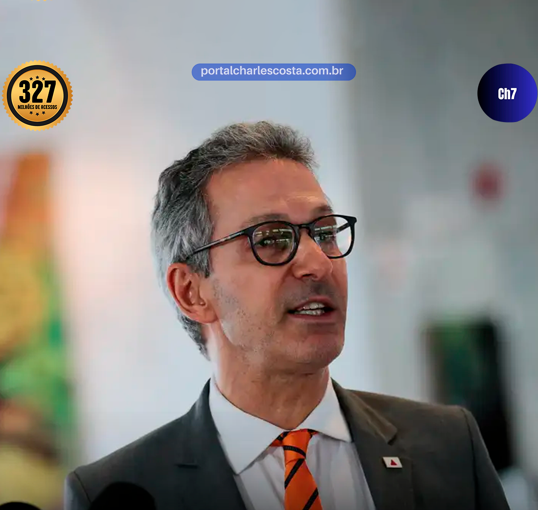 Romeu zema de terno e gravata única laranja